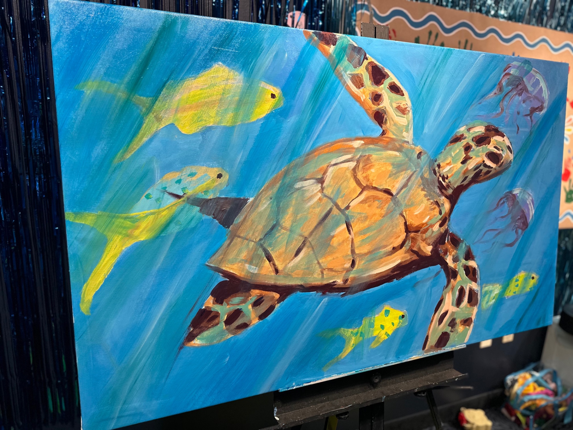 A colorful sea turtle mural painted during camp