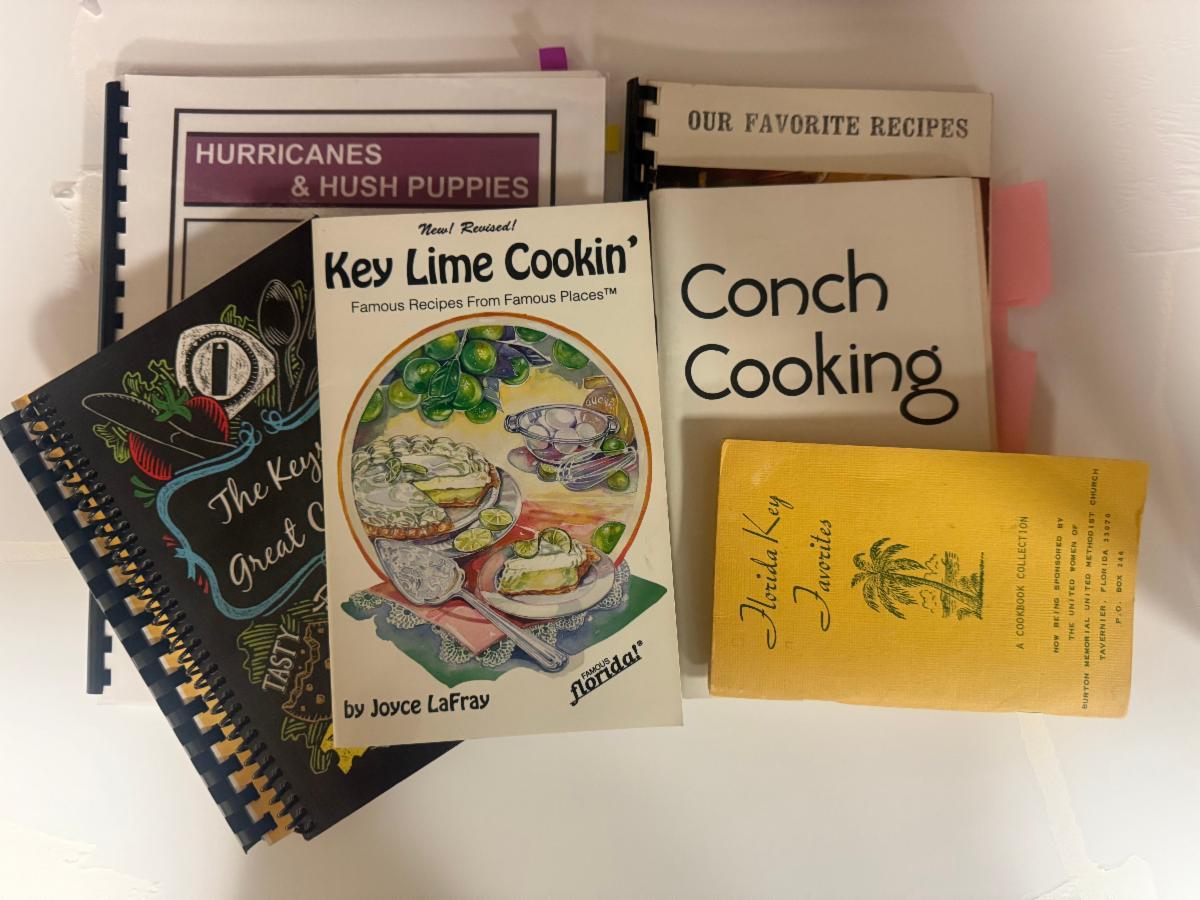 Vintage Florida Keys cookbooks including Key Lime Cookin', Conch Cooking, and Florida Key Favorites