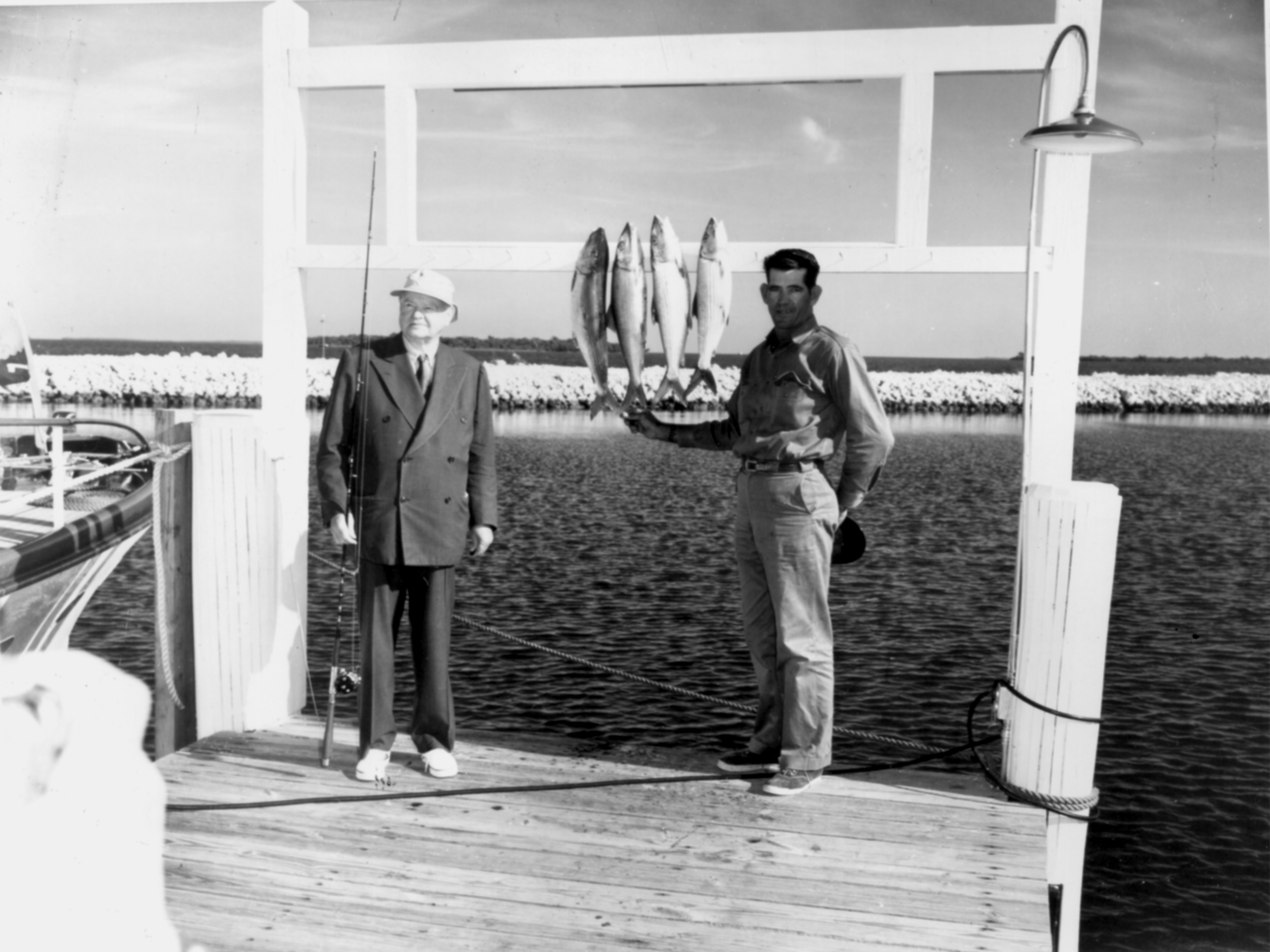 Former President Herbert Hoover with Upper Keys fishing guide Calvin Albury at a Key Largo dock in 1956