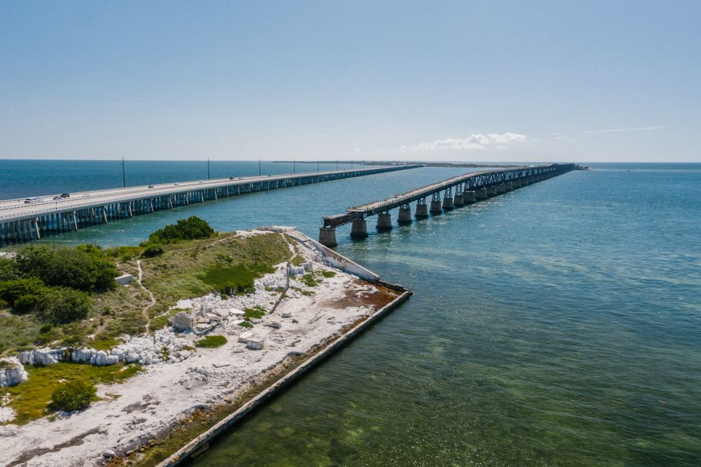 Aerial view of the Seven Mile Bridge stretching across blue water in the Florida Keys